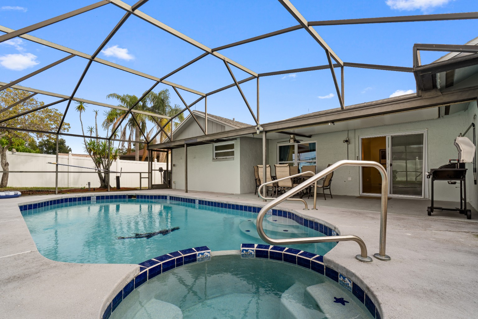 Private swimming pool and screened patio